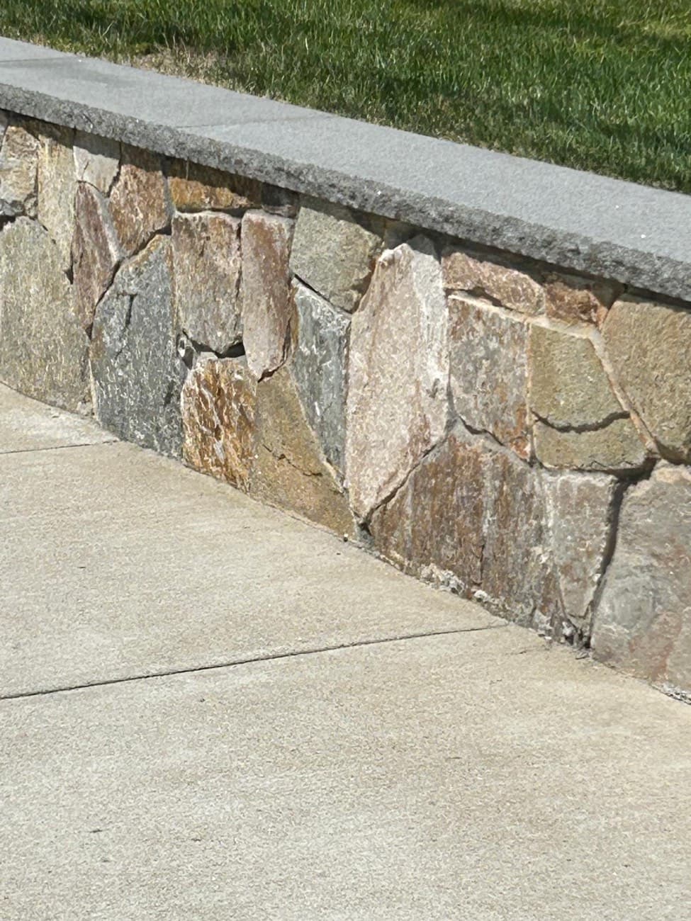 Stone Veneer Sitting Wall built by Levi Construction in RI & MA